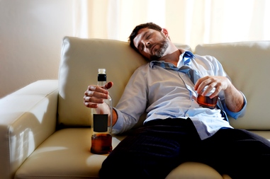 drunk business man wasted and whiskey bottle in alcoholism