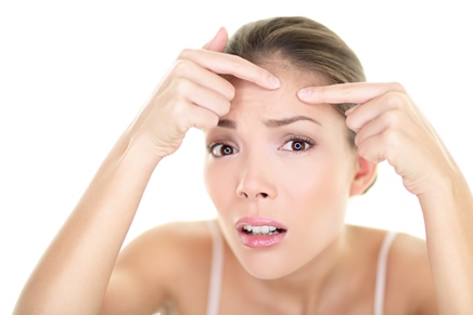 Acne spot pimple - skin care girl and skin problem